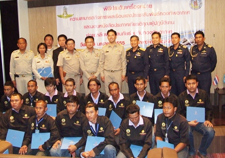 Royal Thai Air Force officers present certificates and Civil Affairs logos to Mayor Itthiphol Kunplome, Deputy Mayor Wutisak Rermkitkarn and 15 other Sanitation, Water and Engineering department workers.